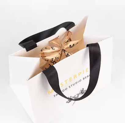 Good price Art Paper Shopping Bag Packaging Kraft Paper Bag With Embossed Logo online