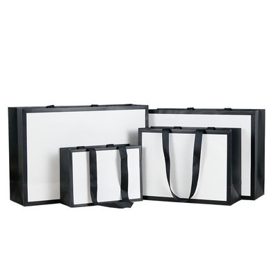 Buen precio Bolsas de papel de regalo con textura elegante Bolsas de compras premium para tiendas de ropa Regalos en línea