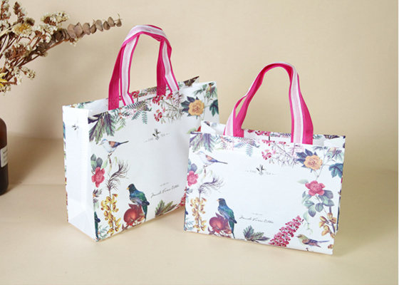 Good price Premium Printed Paper Shopping Bags Floral Bird Design With Pink Striped Handles online