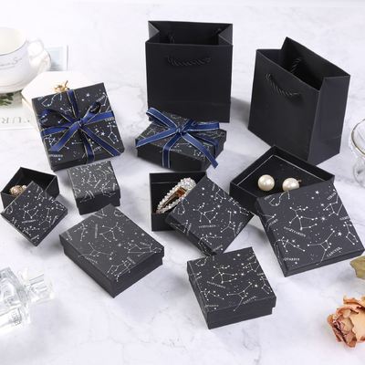 Buen precio Elegante caja de regalo de joyería negra con constelaciones, diseño del zodiaco estampado en caliente para anillos, pendientes y collares en línea