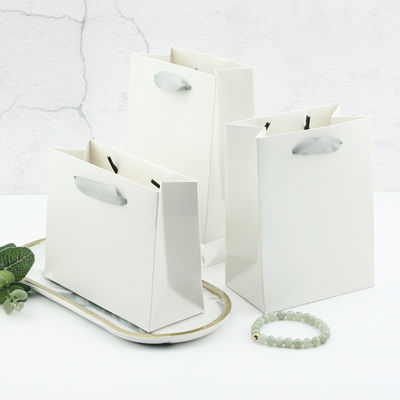 comprar Bolsas de papel de color blanco para embalaje de joyas Bolsas de regalo personalizadas de cumpleaños y vacaciones con impresión de logotipo Fabricación en línea