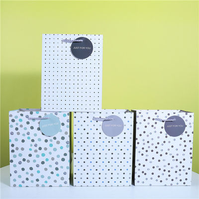 Buen precio Bolso de regalo de tarjeta blanca Bolso de regalo de Polka Dot Bolso de papel granular Bolso de embalaje de regalo en línea