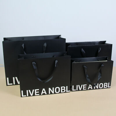 comprar Sacos de presente de papel Kraft espessado Cartão branco Sacolas de compras para lojas de roupas Impressão de logotipo personalizado Sacos de embalagem Fabricação em linha