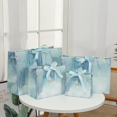 Bon prix Courier personnalisé Sacs de magasinage en papier à la mode Sacs de magasinage en papier Euro Shopper en ligne