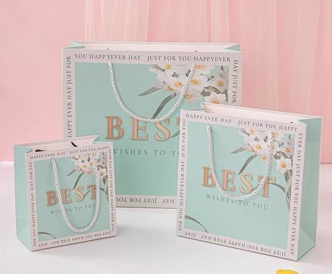 Harga yang bagus Tas Tote Kardus Putih tebal yang disesuaikan Pencetakan Warna Tas Hadiah Kosmetik Baju Belanja Kantong Kertas on line