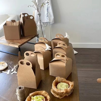 Giá tốt. Hộp bánh Basque Kraft giấy tùy chỉnh với tay cầm xoắn trực tuyến