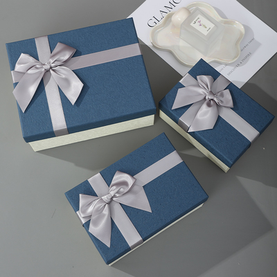 Good price Luxe Blue Gift Box Set Premium Hinged Cosmetic Perfume Packaging With Silver Ribbon online