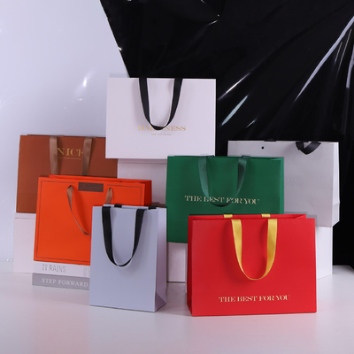 Good price Hot Stamping Handbags With Customized Logo Thickened White Cardboard Shopping Paper Bags online