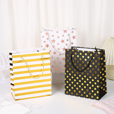 Good price Hot Stamping Polka Dot Paper Bag Thick White Cardboard Handbag Shopping Gift Bag Gift Packaging online
