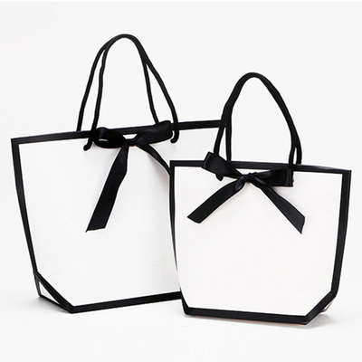Bon prix Des sacs de magasinage en papier de luxe imprimables en stock en ligne