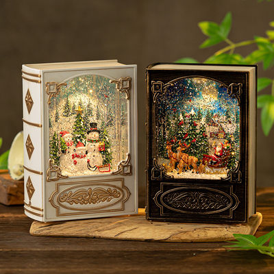Harga yang bagus Christmas Musical Snow Globe Book Light Rotating LED Night Light With Music Box on line