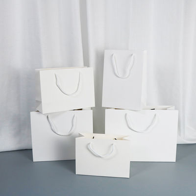 Good price Solid Color Paper Bag With Logo Printing Thick White Card Shopping Gift Bag Clothing Store Handbag online